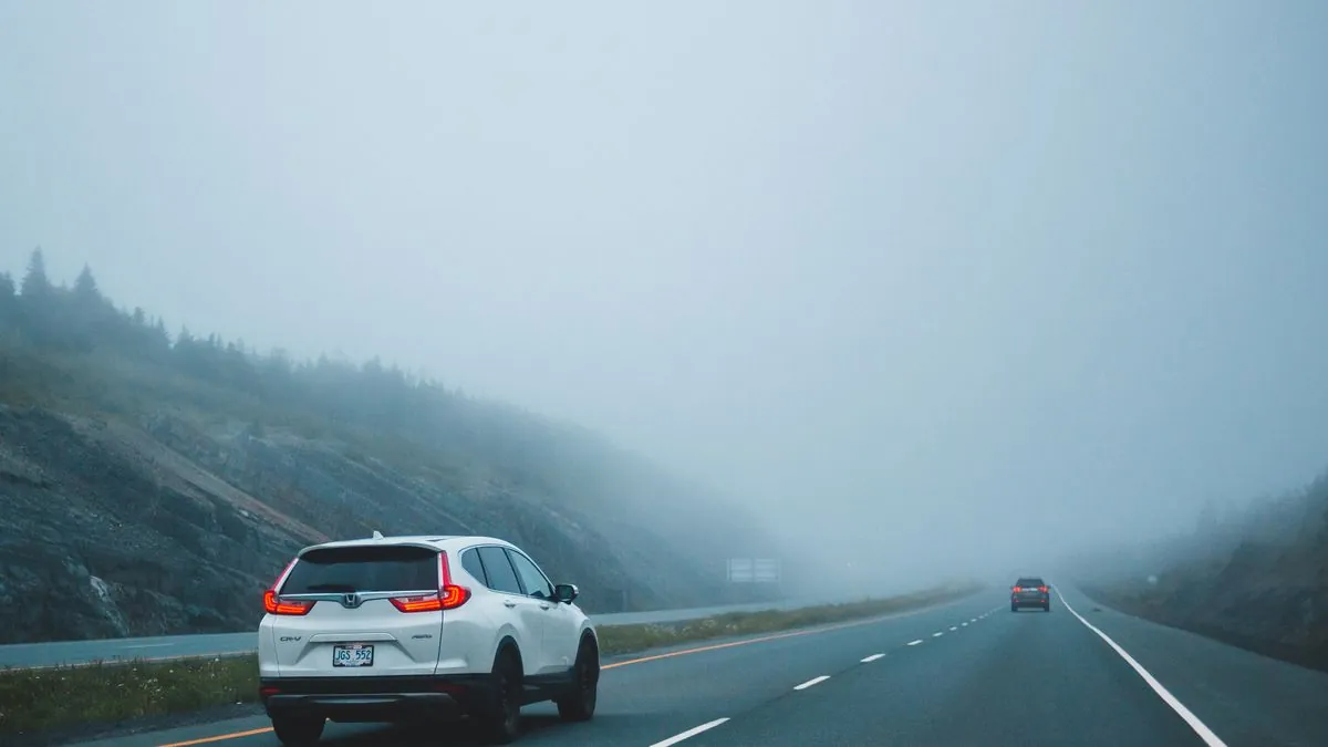 A car stopped safely on the hard shoulder of the M25