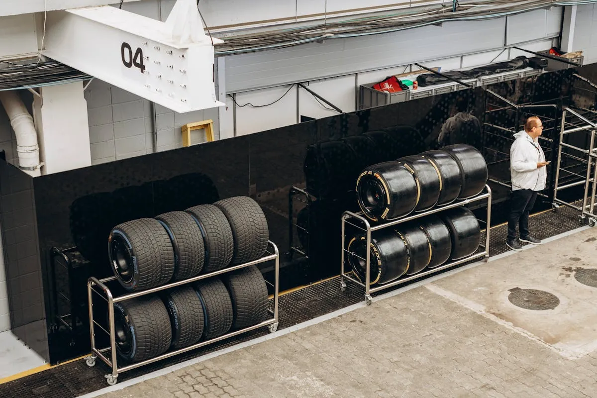 New tyres from a range of UK tyre brands stacked in a workshop