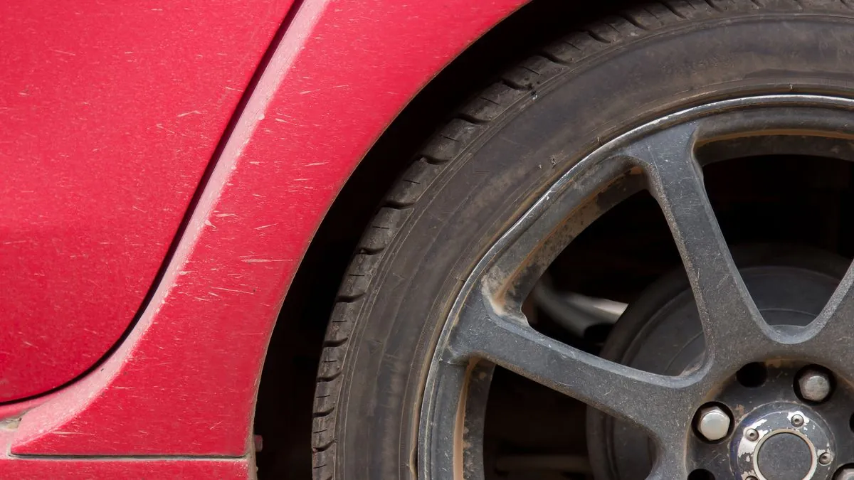 A parent discovering a flat tyre on the school run
