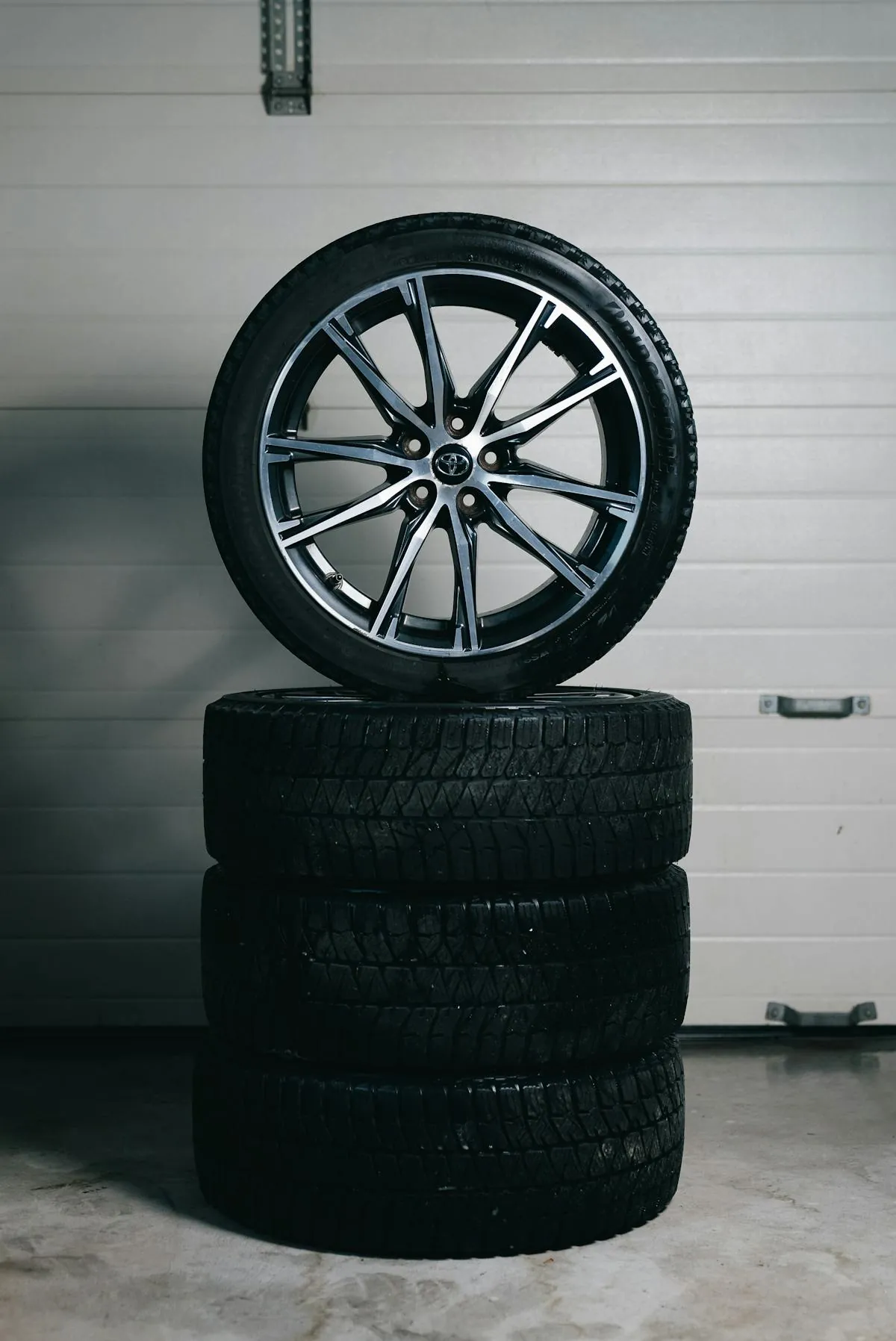 A stack of new car tyres ranging from budget to premium brands