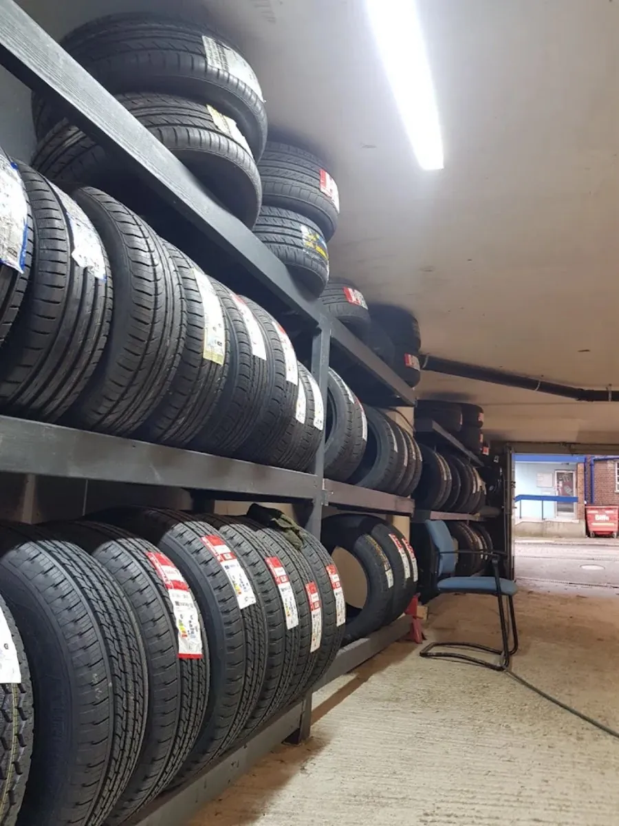 Racks of new tyres in stock at the Rescue Tyres unit